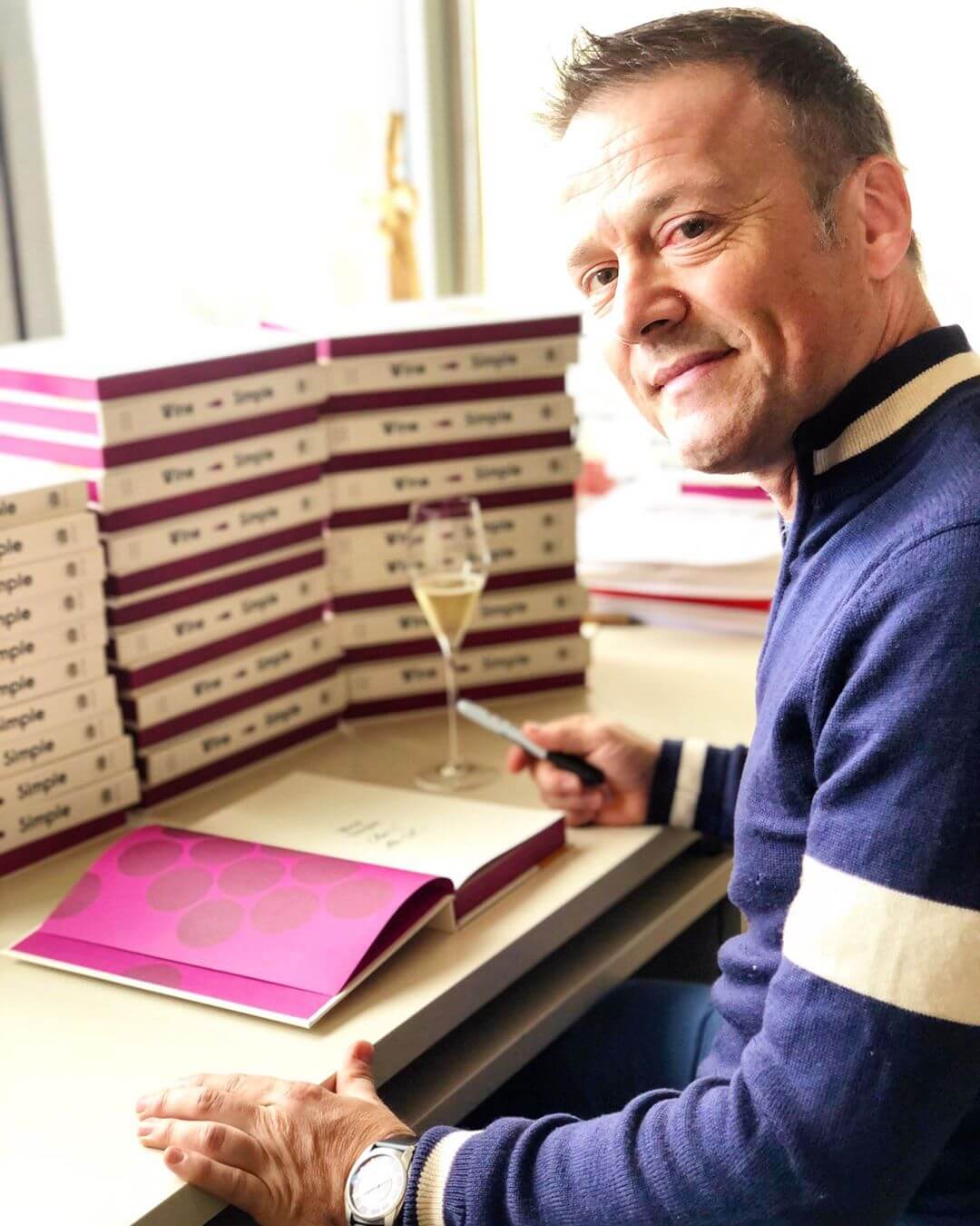 Aldo Sohm signing copies of his book Wine Simple.