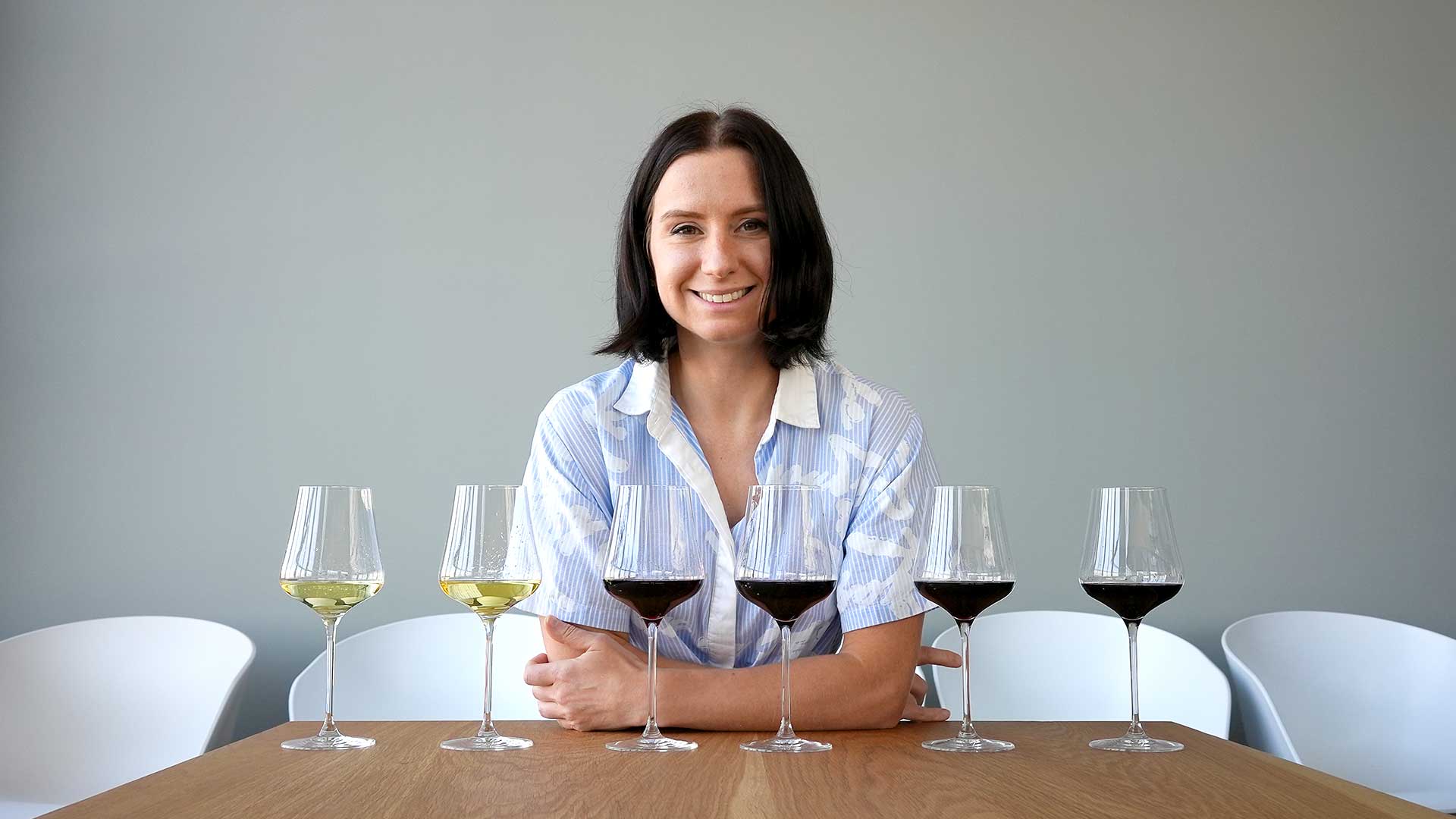 Madeline Puckette with six Napa Valley wines